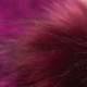 Blommefarvet strikhue med kvast i cashmere